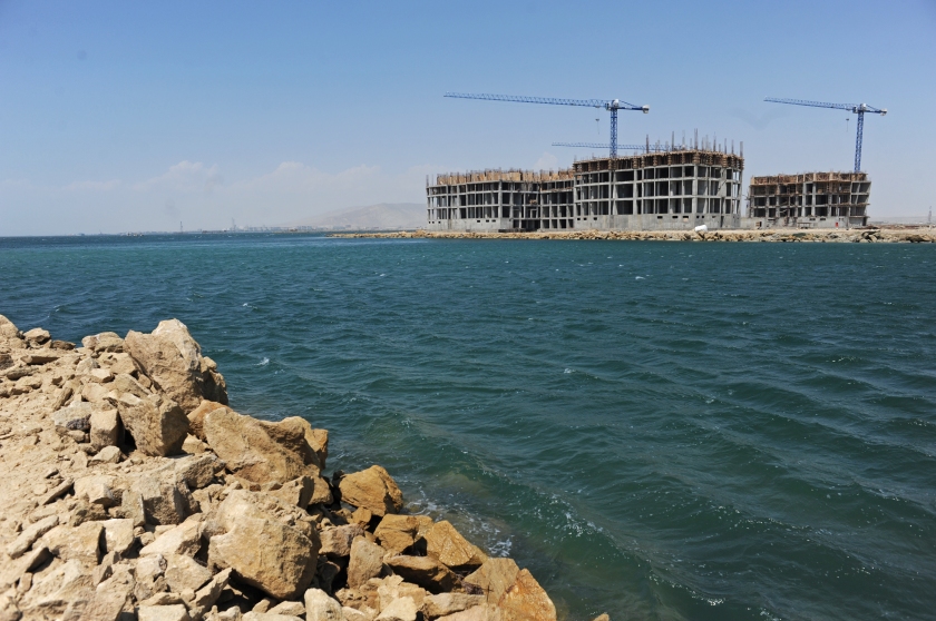 Some of the first buildings are seen under development at the Khazar Islands project near Sahil, Azerbaijan on July 18, 2012.  The brainchild of Ibrahim Ibrahimov, an Azerbaijani oligarch and billionaire, the artificial Khazar Islands project just southwest of the Azerbaijani capital Baku is being built at a projected cost of $100 billion with an anticipated 800,000 housing units.